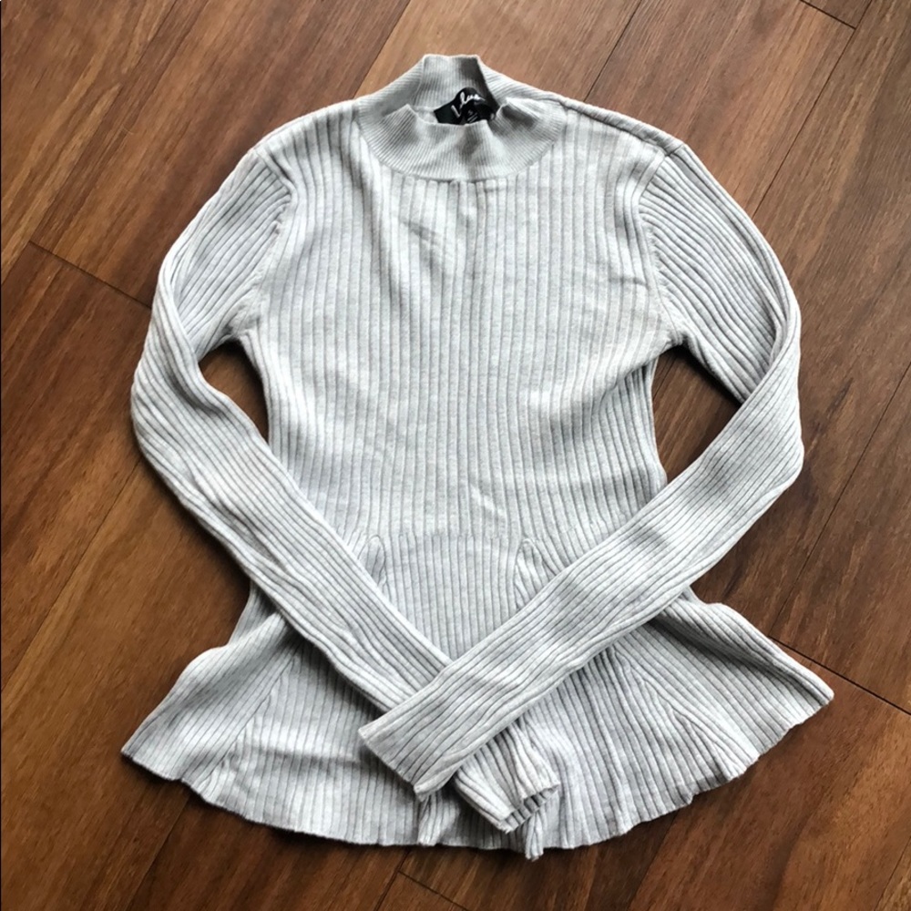 Grey long sleeve peplum knit top